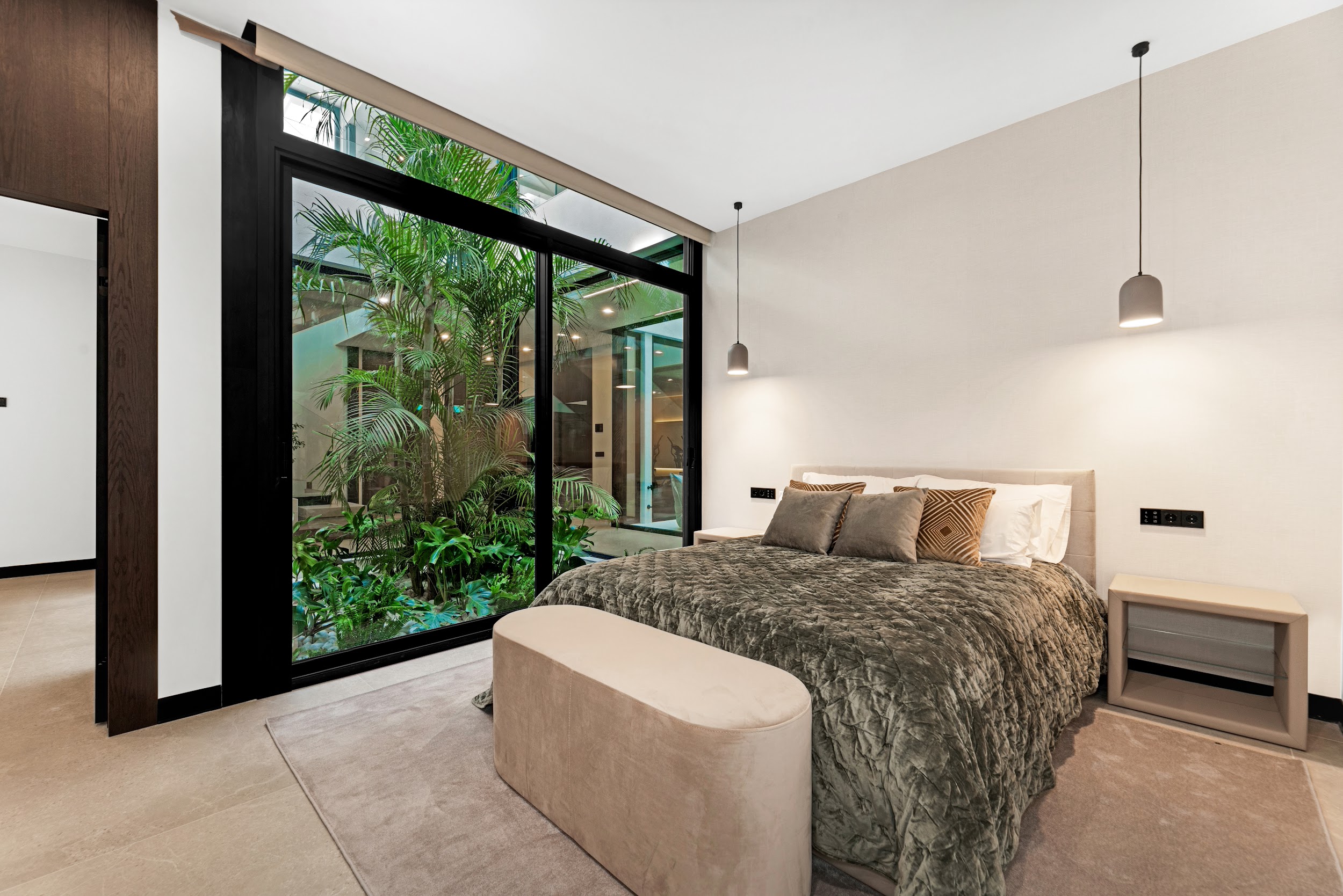Bedroom with tropical courtyard